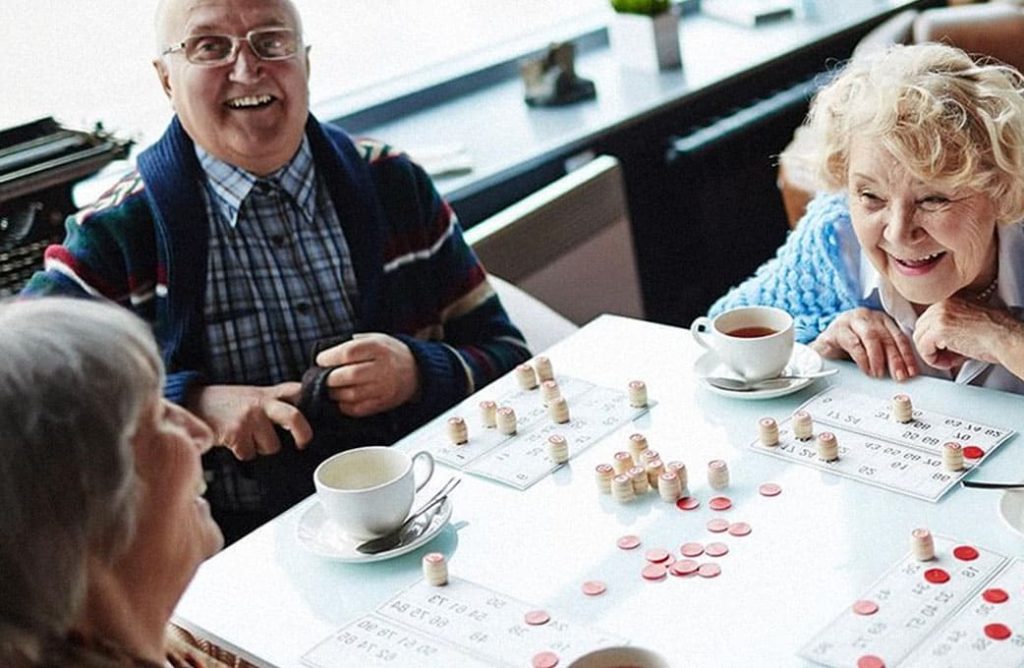 Older people playing bingo